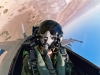 An aviator assigned to Air Test and Evaluation Squadron (VX) 9 wearing modern flight gear looks out the canopy of his F/A-18F Super Hornet as he conducts a maneuver above the south end of Panamint Valley near China Lake, California, September 7, 2005.
