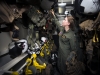 Lieutenant (junior grade) Sarah Alexandre, a pilot assigned to  Helicopter Sea Combat Squadron (HSC) 4, stows flight gear in a paraloft following flight operations aboard the aircraft carrier USS Carl Vinson (CVN 70), January 7, 2017.